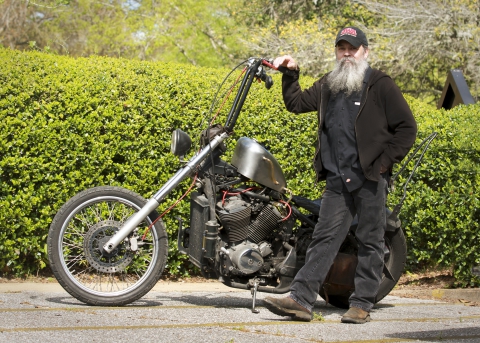 UWA printer Tommy Hutchins and his motorcycle.