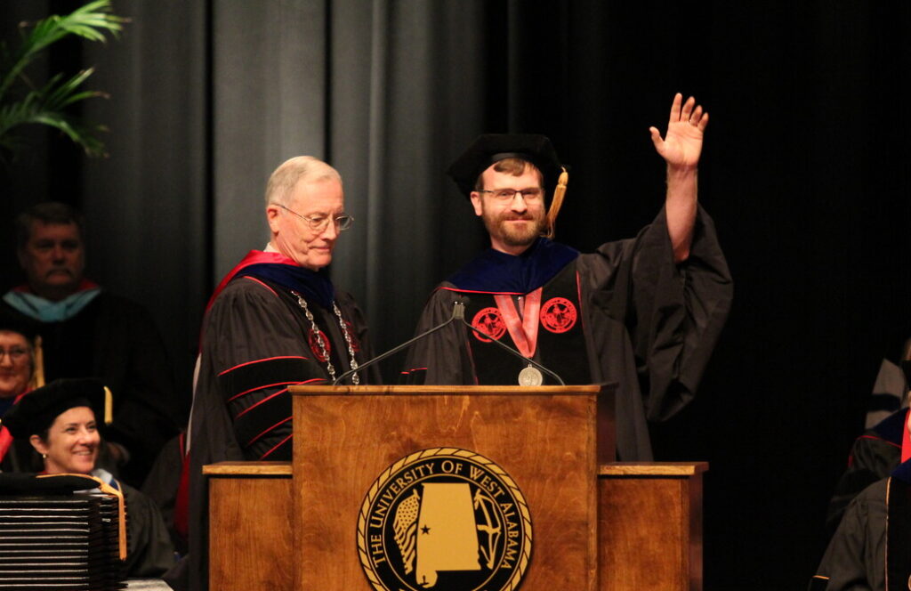 Lucas Johnson beside President Ken Tucker at UWA commencement